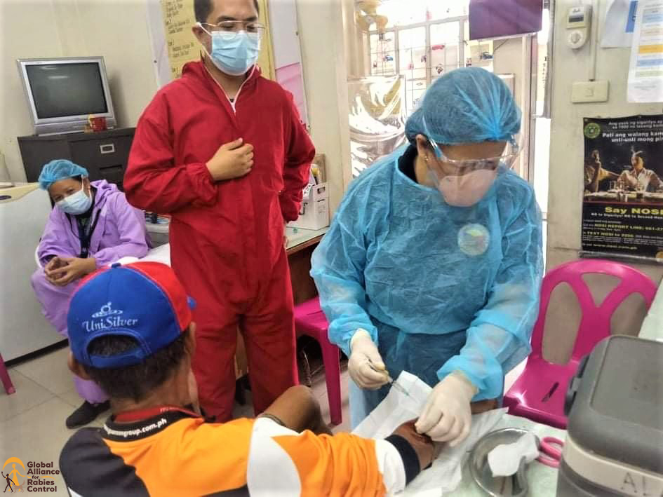 Health workers (Rabies saviors) in Alabang, Philippines, provide rabies post-exposure prophylaxis to a bite victim in the midst of the COVID-19 pandemic.