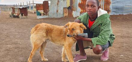 Boy and Dog, Kenya. Credit: James Ngatia Mpala research center