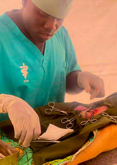 Castration being performed by Dr. LOKU MOSES SAMUEL of LMS ANIMAL CLINIC. This is done to control dog population in the community.